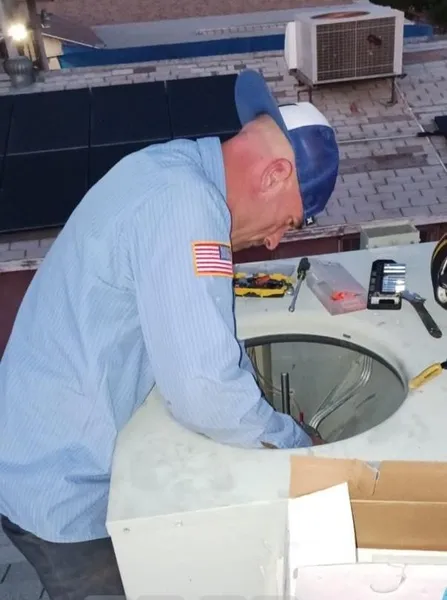 We Care Air technician servicing commercial rooftop HVAC unit