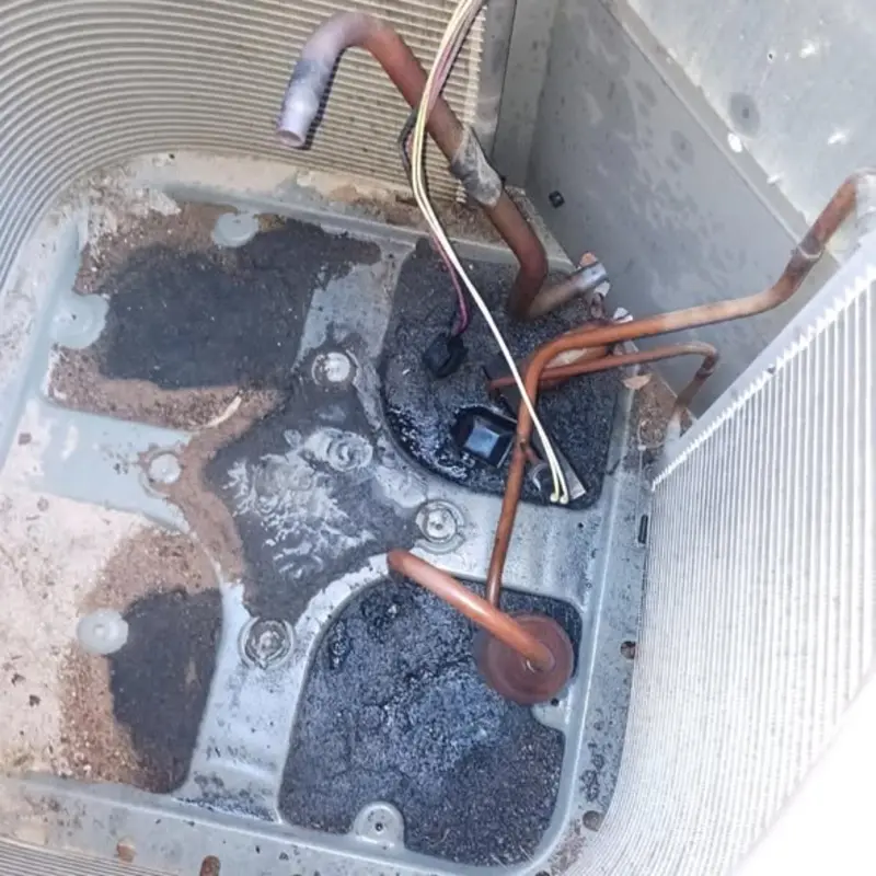 Inside of an AC condenser clogged with desert dust and debris in Spring Valley