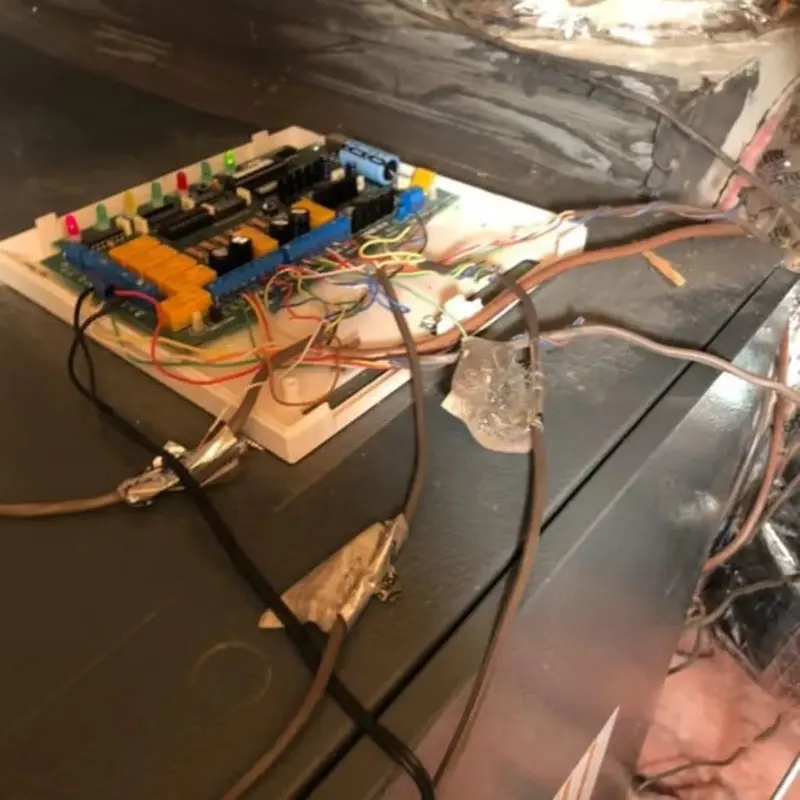 Worn HVAC control board with tangled wiring found during a repair in The Lakes